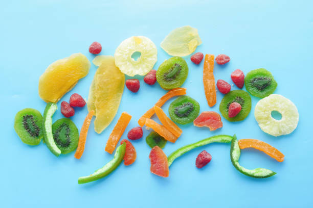 istock Dried fruits and berries on blue background 1346027003