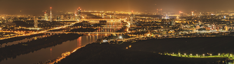 Panorama of Vienna Austria by Night From Above Many Lights and the Danube River Crossing the City Skyline