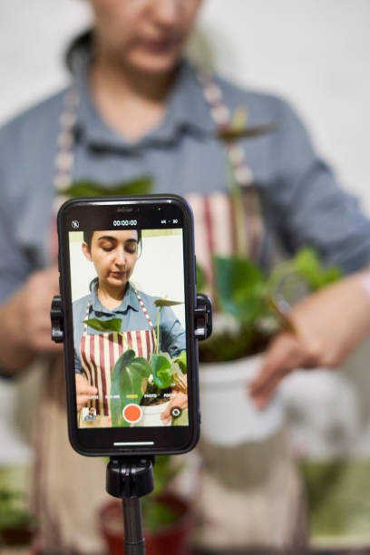 istock Multiracial florist blogger live streaming online 1346027730