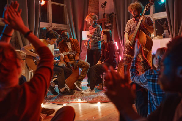 istock Men playing on musical instruments for friends 1346028065