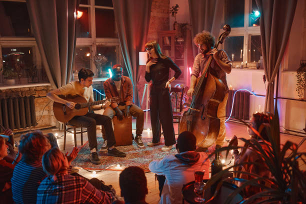 istock Music band performing for people in the studio 1346028150