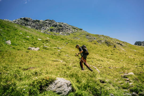 istock Hiker doing trekking along the high mountain path 1346029259