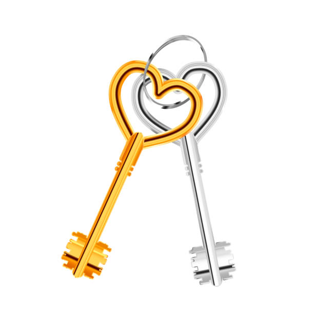 istock Couple of ancient door keys in heart shape on ring on white 1346030629