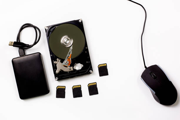 computer and hard disk device on white background, - open harddisk flash imagens e fotografias de stock