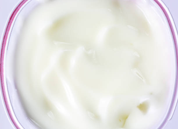 istock macro yogurt texture,High resolution beautiful splash of fresh milk. White background. Texture. 1346031046