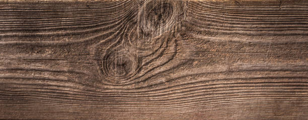 istock Dark Brown Wood Texture with Scratches as Background 1346032528