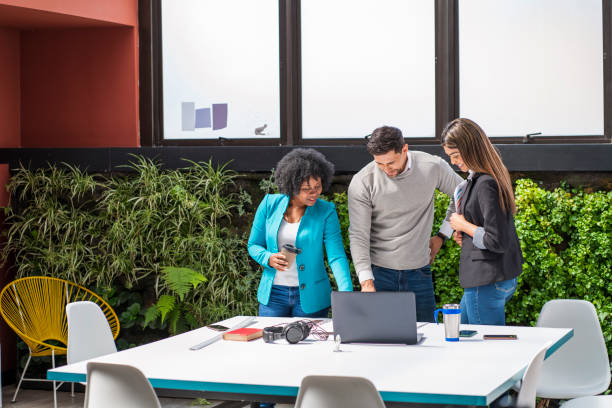 istock multi-racial coworkers are in the meeting room talking about office issues 1346032745