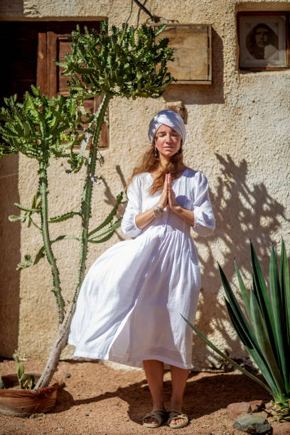 istock Beautiful woman resting in the desert 1346034062
