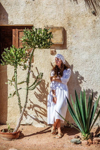 istock Beautiful woman resting in the desert 1346034064