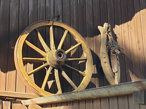 istock Old wagon wheel and horse collar 1346035174