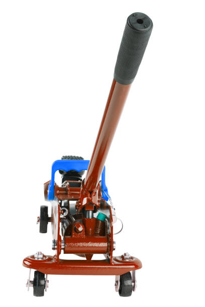 red hydraulic car jack isolated on white background, lowered