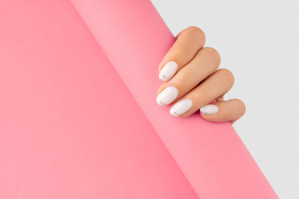 istock Womans hands with trendy white french manicure 1346037886