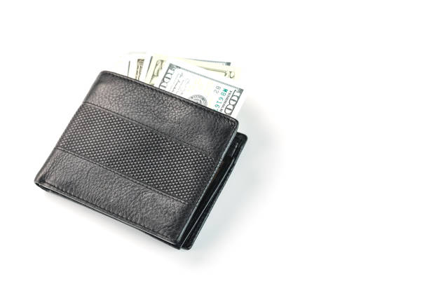istock Black wallet with genuine leather dollars on an isolated white background. 1346038001