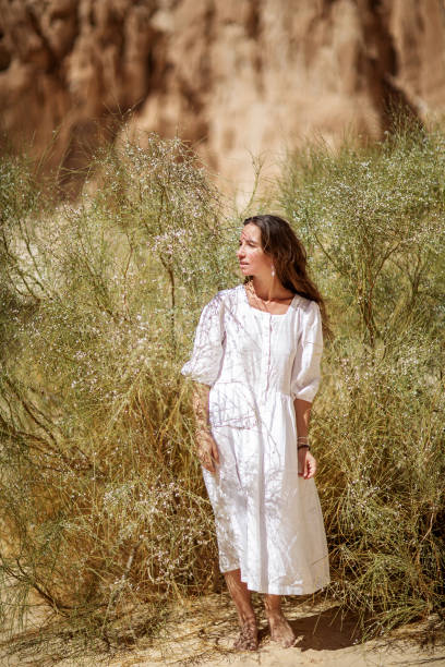 istock Beautiful woman resting in the desert 1346038841