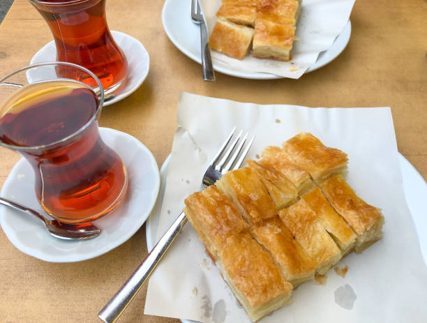 istock Sliced ​​phyllo pastry and Turkish tea on the table 1346039081