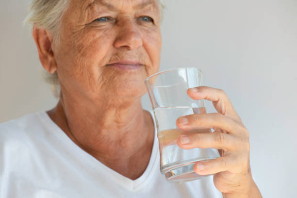 istock Senior Woman Drinking Water 1346039224