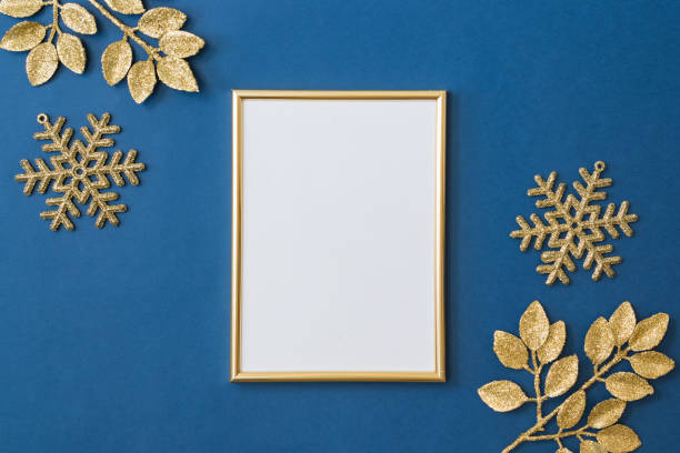 istock Christmas holiday composition. Flat lay mockup frame with christmas golden decorations on a blue background 1346039410