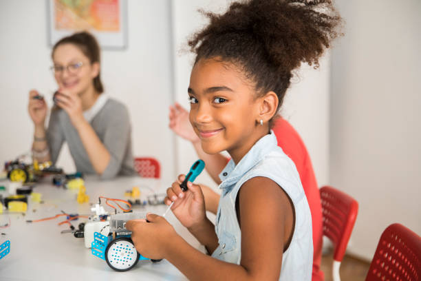 istock Girl working on a robot design 1346040519