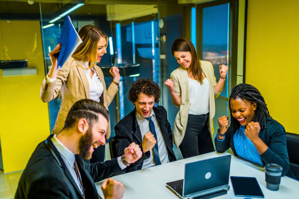 istock Business team employees celebrating success 1346040897