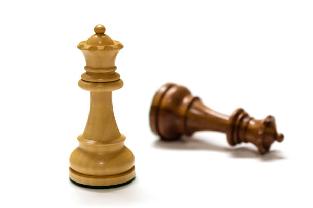 Two chess pieces isolated on white close up.