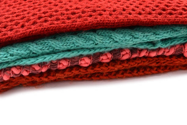istock Knitted red, orange, green scarves. 1346042227
