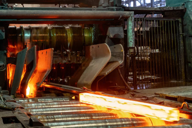 istock The process of rolling hot rolled steel in a rolling mill 1346044923
