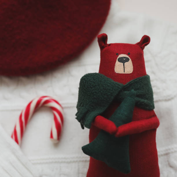 Christmas composition. Toy Teddy Bear, a gift, fir tree branches and decorations. Christmas, winter, new year concept. Flat lay, top view, copy space.