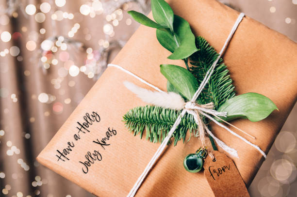 istock Hands are holding gift in eco paper 1346046458