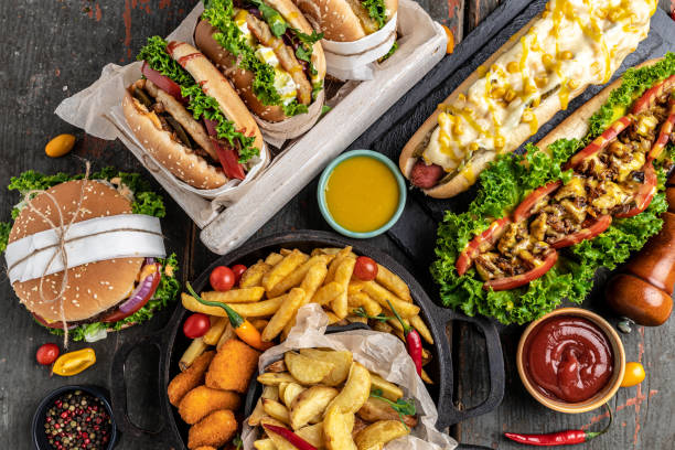 American fast food. Hamburgers, French fries, hot dogs. fast food and unhealthy eating concept. top view stock photo