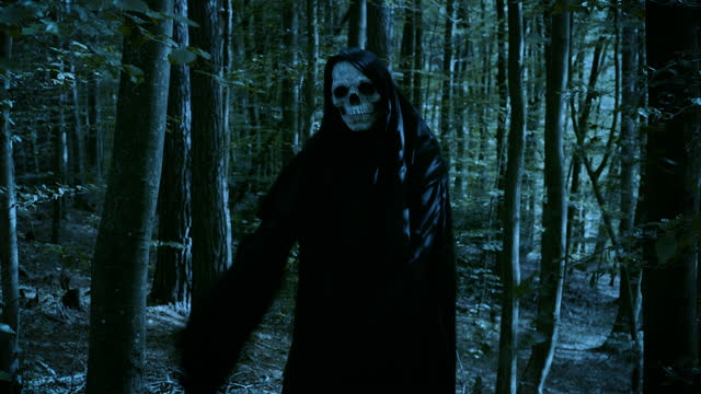 Funny Grim Reaper skull dancing in the forest.