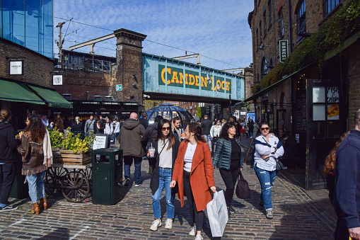 London, United Kingdom - April 18 2021: Busy Camden Market and Camden Lock on a clear day.