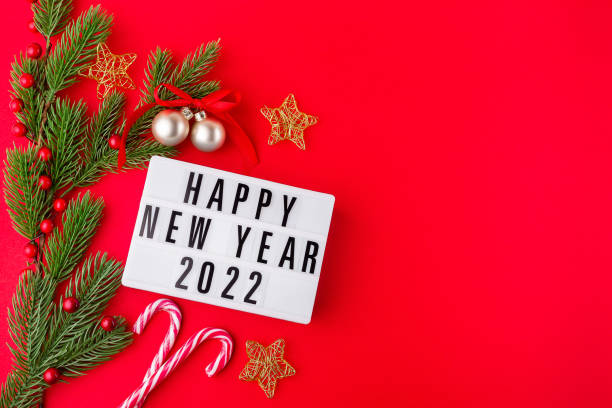 istock Festive composition with pine branches, stars, candy cane, festive balls and light box 1346049898