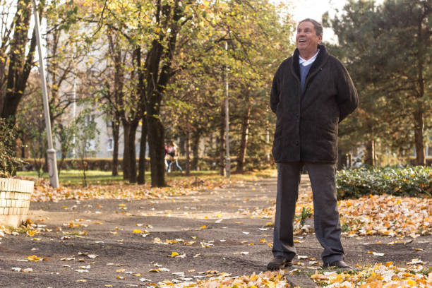 istock Senior man enjoying taking a walk in nature 1346053697