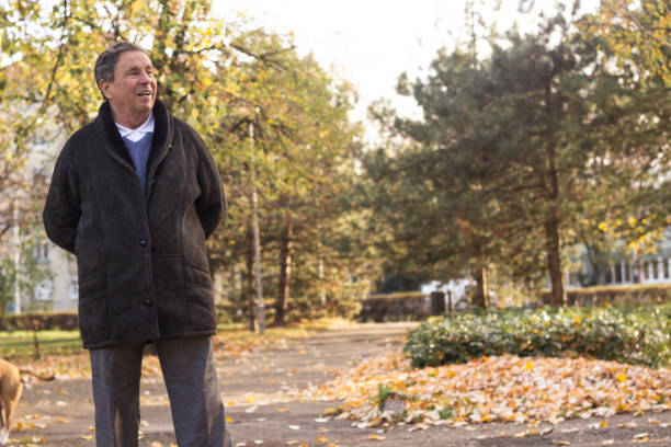 istock Senior man enjoying taking a walk in nature 1346053929