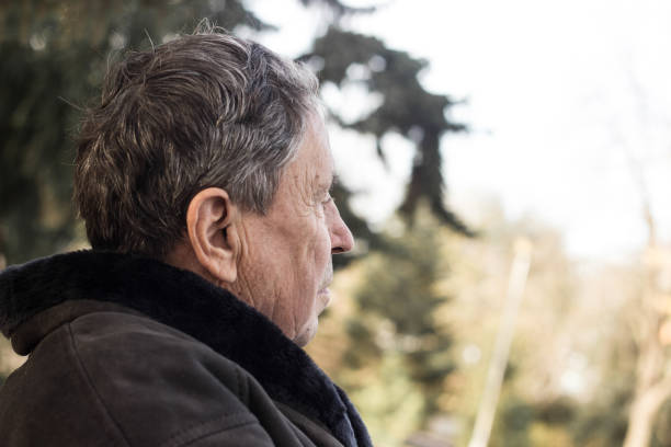 istock A lonely senior man sitting on the bench in park 1346054593