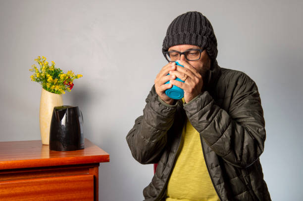 istock person having coffee with warm clothes 1346059738