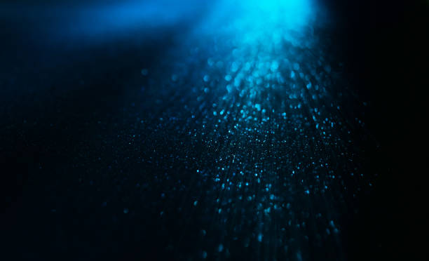 istock Abstract background of blue glitter lights. De-focused background. Banner size 1346060829
