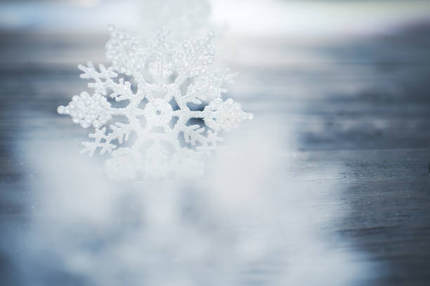 istock Christmas decor. White snowflakes on wooden background. Rustic style 1346062009