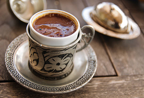 Turkish coffee served in a traditional Turkish metal dish cup