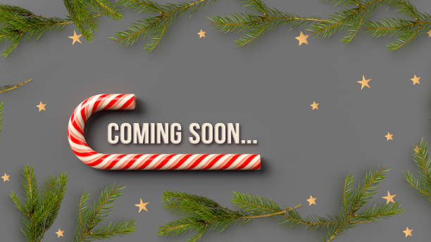 istock big candy cane surrounded by christmas decoration and the message COMING SOON... 1346065577