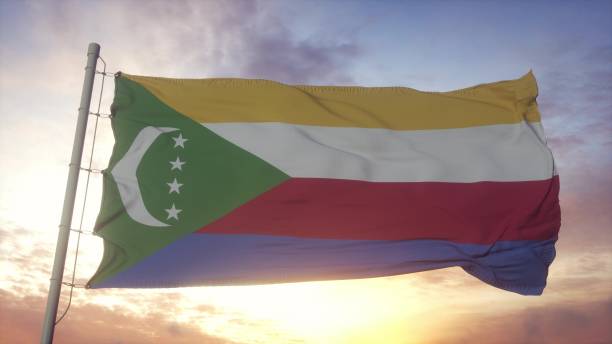 istock Flag of Comoros waving in the wind, sky and sun background. 3d rendering 1346065715