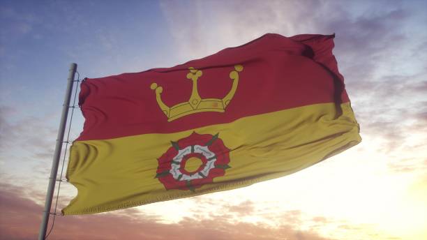 istock Hampshire flag, England, waving in the wind, sky and sun background. 3d rendering 1346065950