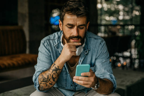 istock Man waiting in an airport lobby 1346066828