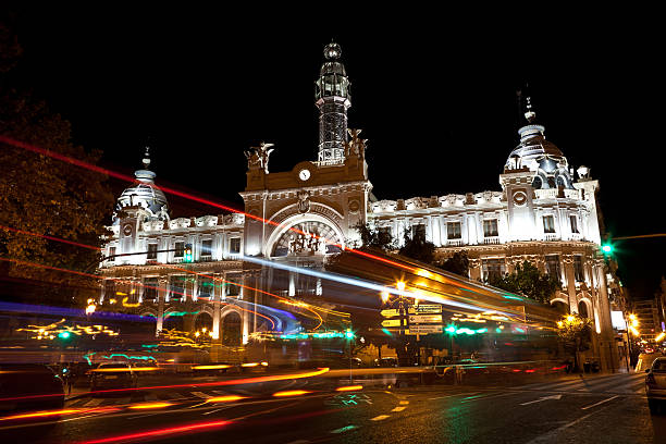 with traffic motion blur at night. Real name of this building is Palacio de Comunicaciones. Built in 1922 by architect  Miguel Ángel Navarro