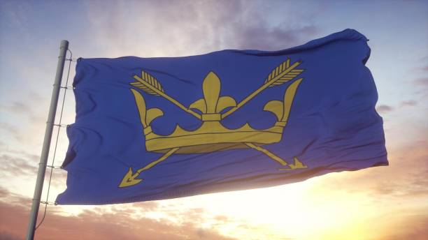 istock Suffolk flag, England, waving in the wind, sky and sun background. 3d rendering 1346068005