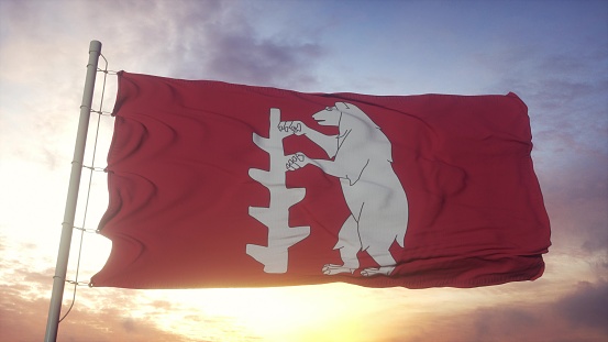 Warwickshire flag, England, waving in the wind, sky and sun background. 3d rendering.