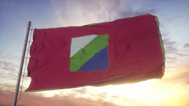 istock Abruzzo flag, Italy, waving in the wind, sky and sun background. 3d rendering 1346068269