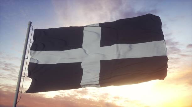 istock Cornwall flag, England, waving in the wind, sky and sun background. 3d rendering 1346068304