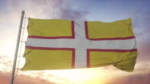 Dorset flag, England, waving in the wind, sky and sun background. 3d rendering.