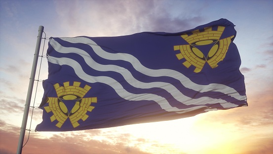 Merseyside flag, England, waving in the wind, sky and sun background. 3d rendering.
